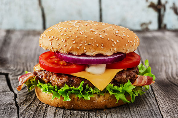 Juicy hamburger in an office